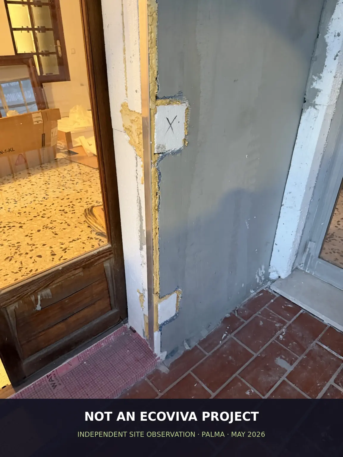 Independent third-party ETICS project in Palma showing a door frame and threshold transition